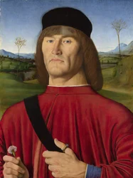Mann mit einer rosa Nelke